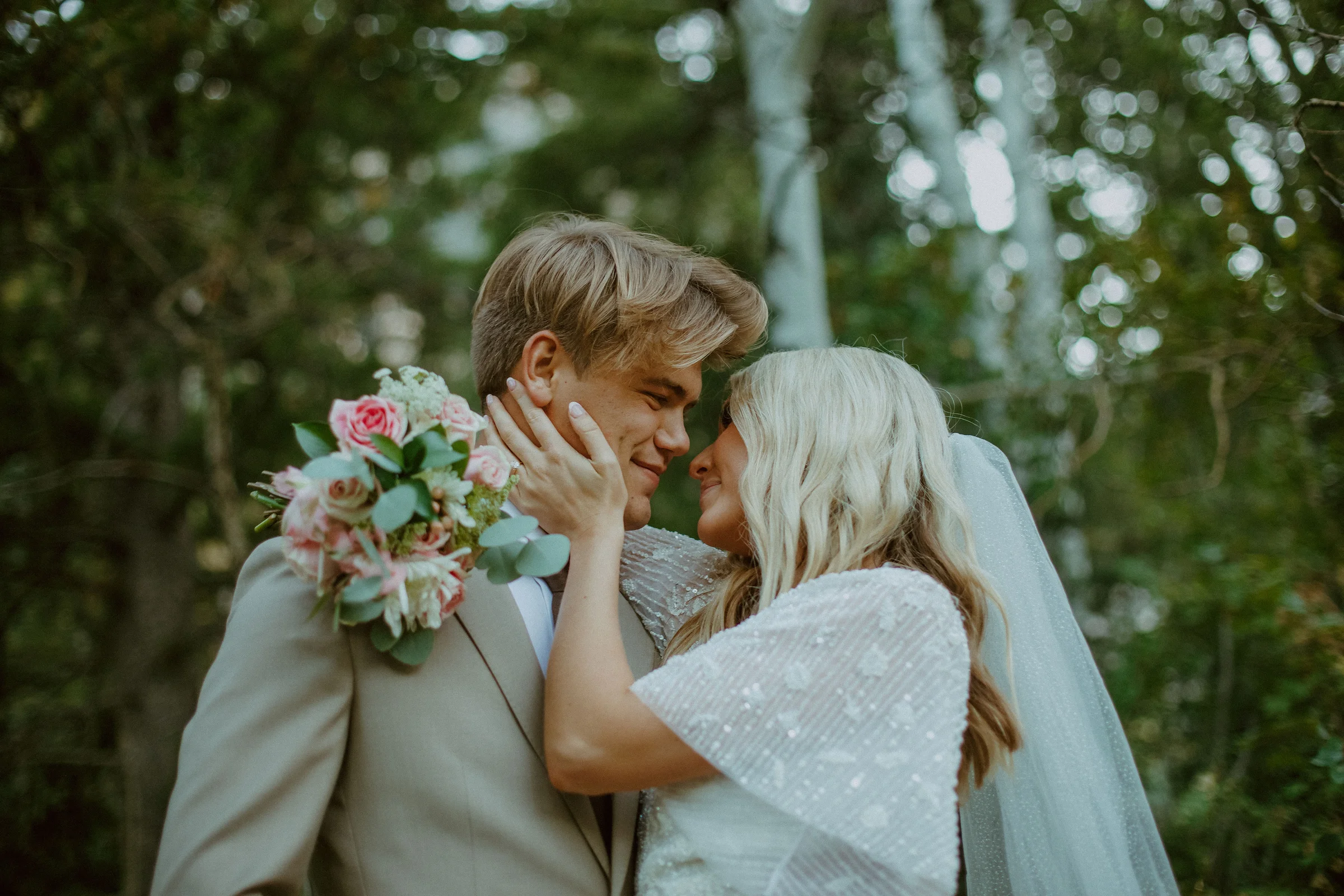 Couple with a pastel bouquet outdoors